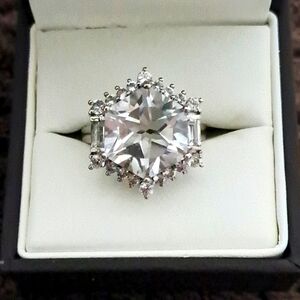 White Topaz Halo Ring In Platinum Over 925 Sterling Silver.